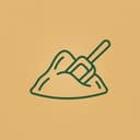 Scoop in a mound of raw material powder